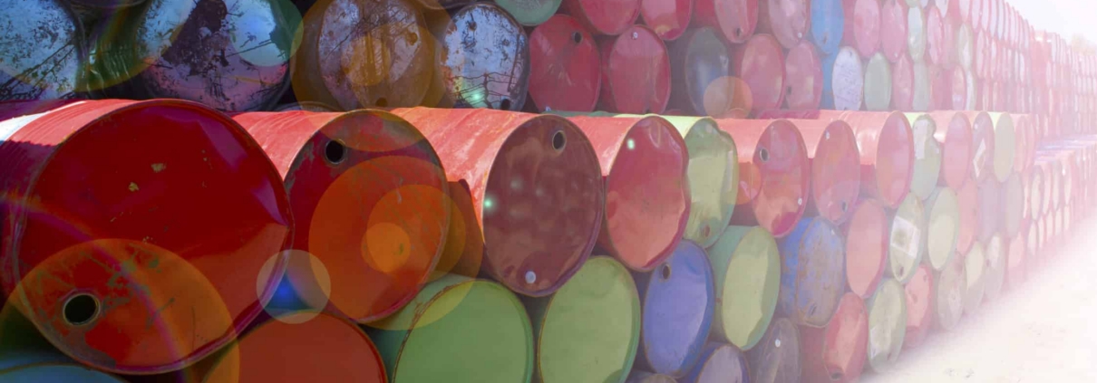 Stack of oil barrels representing global fuel supply