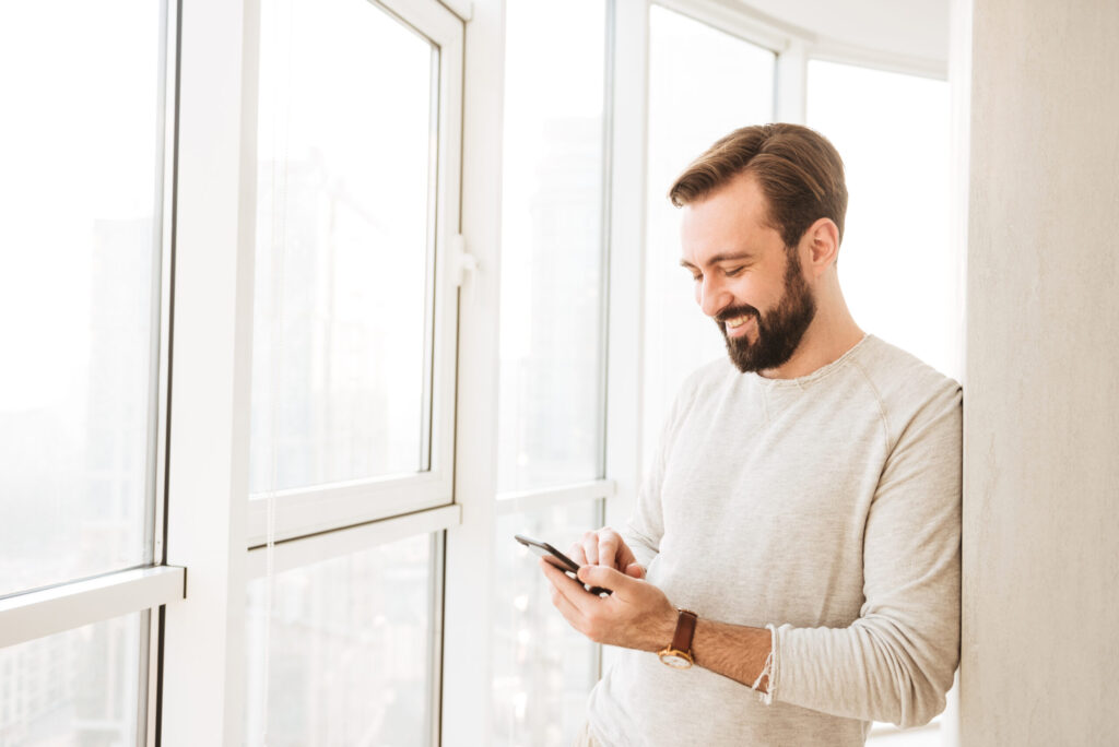 Home heating oil in NYC-Photo of relaxed guy 30s having beard and mustache, spending tim