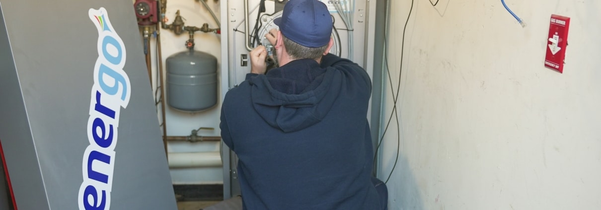 Energo HVAC maintenance technician working in NYC building
