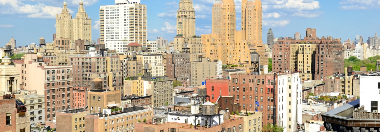 NYC skyline buildings with bright blue sky