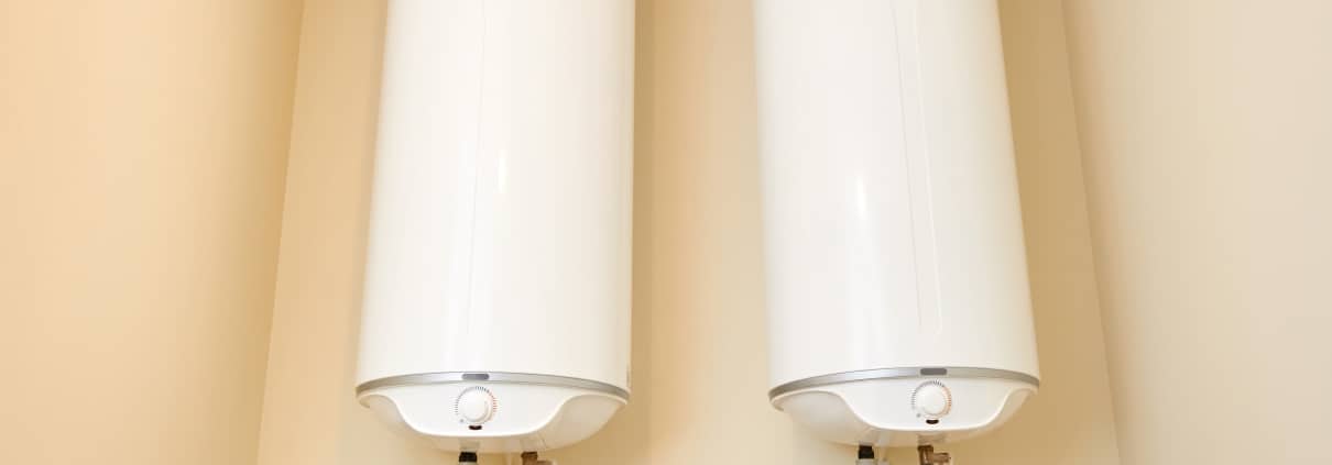 Two electric water heaters on the wall. Home wall mounted two water heating boilers