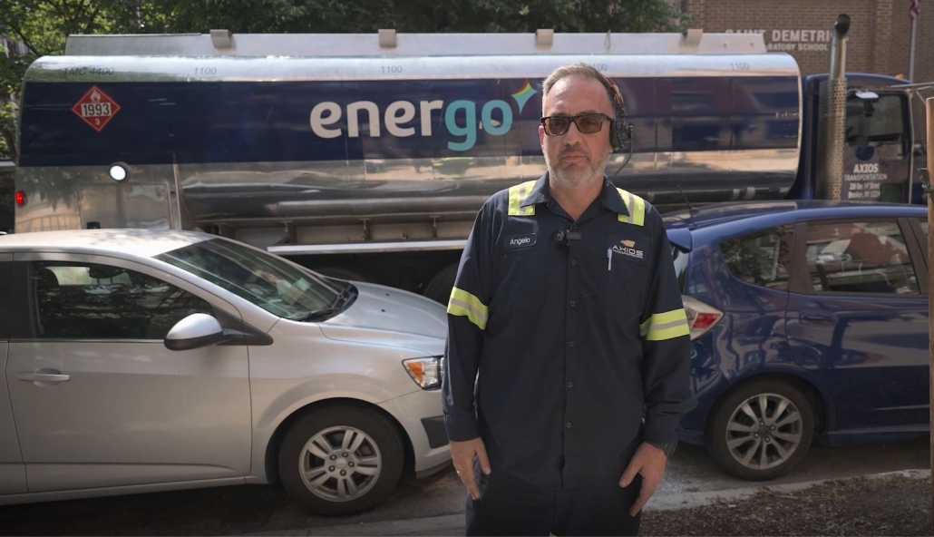 Energo technician standing in front of branded oil delivery truck