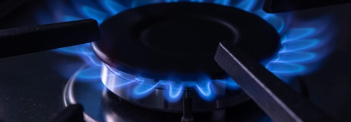 Close-up of natural gas burner flame on stove top