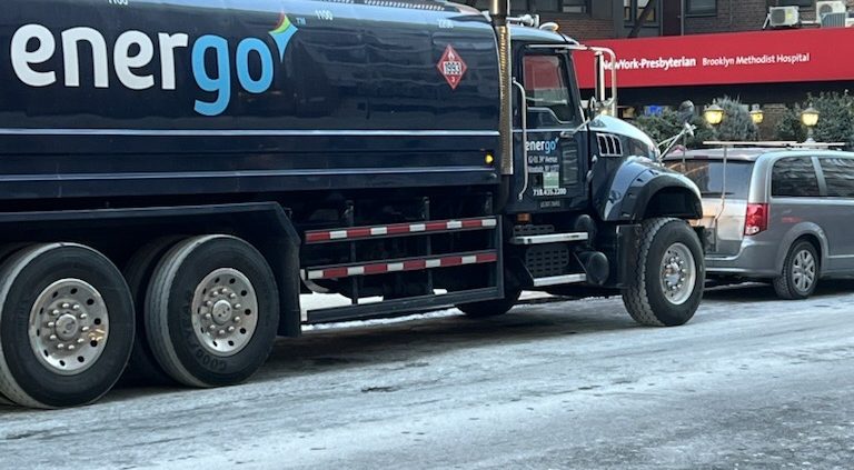 Energo oil delivery truck on snowy city street