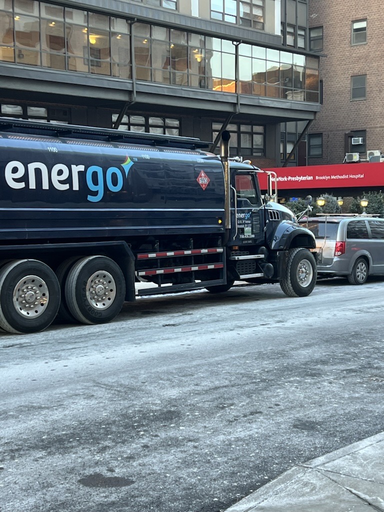Energo oil delivery truck on snowy city street