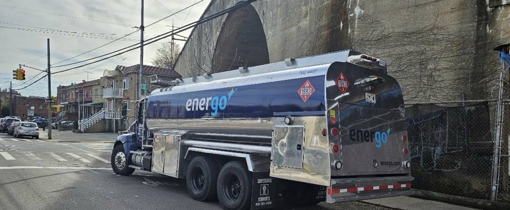 Energo branded heating oil truck parked by industrial facility