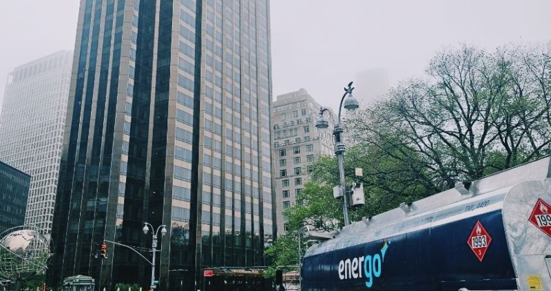 Energo heating oil truck on NYC street with skyscrapers in background