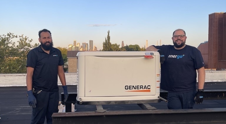 Generac installation with two employees