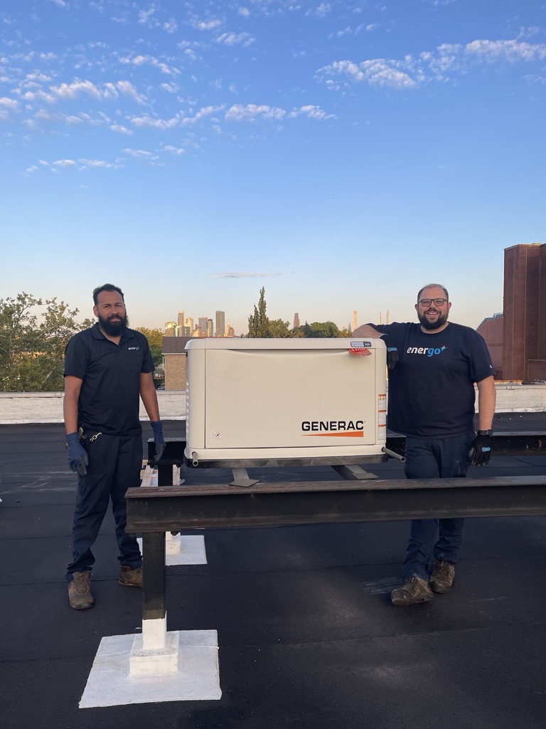 Generac installation with two employees
